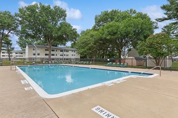 Swimming pool and large sun deck with seating